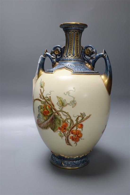 A Royal Worcester porcelain two-handled vase, the bulbous body painted with fruit and foliage, height 31cm, shape 1200